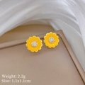Close-up of yellow sunflower stud earrings with white zircon center on beige jewelry box - Gold Plated Copper / Yellow Daisy Studs
