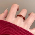 Detailed close-up of 14K gold plated oval red resin ring on woman's finger - Red (Real Gold Plated)