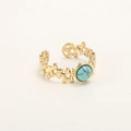 Detail of adjustable gold ring featuring cutout stars and a turquoise center stone - RA04-4/Gold Malachite Green/Hollow Star