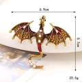 Macro shot of vintage dragon brooch with gold alloy, red enamel and white rhinestones - Red (Yinglong)