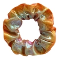 Detail of handmade laser fabric scrunchie with metallic orange and purple gradient texture - Neon Orange