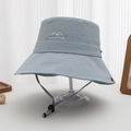 Detail view of quick-dry sun hat with MOUNTAIN logo and adjustable windproof cord - 52-54cm / Blue