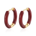 Macro shot of hinged gold hoop earrings with deep red enamel finish on white background - Red