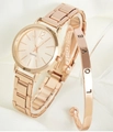 Luxurious rose gold quartz watch and LOVE engraved bangle set on white silk - Rose Gold Steel LOVE Set