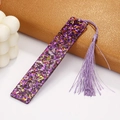Macro detail of purple rectangular acrylic bookmark with glitter and matching tassel - Purple