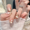Primer plano de uñas postizas ojo de gato champán con purpurina y pedrería - Extra Pequeño (XS) / Ataúd Ultra Corto (310)