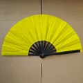 Classic bright yellow folding fan with black bamboo ribs on craft background - Solid Yellow A14