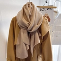 Beige pleated textured long knit scarf for women shown with autumn camel wool coat - Khaki