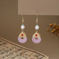 Detail of butterfly pearl tassel earrings with pink Pingan buckle in oriental style - E6419 (Pink/Gold/Pearl/Ping'an Buckle)