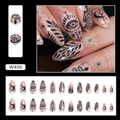 Detailed view of stiletto press-on nails with nude pink base and black mystical patterns - Black Totem (W406)