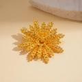 Macro detail of golden wheat flower brooch showing matte texture and layered leaf design - Gold
