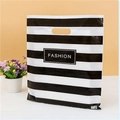 Classic black and white striped plastic gift bag with FASHION logo and die-cut handles - 20x27cm / Black & White Stripes