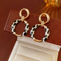 Detailed view of vintage gold earrings with zebra pattern and sparkling rhinestones - 44# Silver Needle - Gold