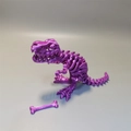 Purple 3D printed Tyrannosaurus Rex skeleton toy with movable joints and bone accessory - Purple