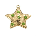 Golden star pendant with hammered texture and green faceted gemstones in a white setting - Green Zircon