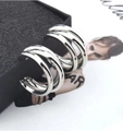 Chic silver layered semi-circle hoop earrings with a trendy multi-ring irregular metal design - Silver