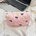 Pink quilted makeup bag with cute cat and pear patterns on a desk with accessories - Black Cat Pear