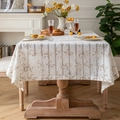 French style beige linen rectangle tablecloth with floral patterns in a warm dining setting - Pteris Flower Coffee