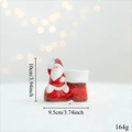 Ceramic Santa Claus sitting on red boot figurine candle holder and desk ornament - Santa in Shoe Candle Holder (Ceramic)