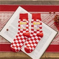Festive red and white checkerboard crew socks with lucky motifs on a book - Make a Fortune