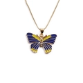 Vintage gold butterfly pendant necklace with blue and yellow enamel wings on white background - Dark Blue