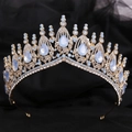 Close-up of golden bridal crown with light blue teardrop stones and clear crystals - KC Gold White Rhinestone + Blue Opal
