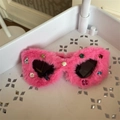 Detail of hot pink plush cat eye sunglasses with colorful rhinestones on a frame - Rose Red