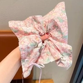 Pink checkered scrunchie with yellow floral patterns and a small ribbon bow for hair - Pink Flower Bow Hair Tie