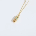 Vintage golden necklace with a colorful zircon-inlaid cylindrical pendant on white background - Colorful Zirconia