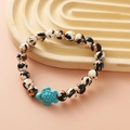Beaded bracelet with black and brown spotted beads and a turquoise turtle charm - Black White Brown Spotted Turquoise Turtle Bracelet