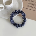 Elegant navy blue satin scrunchie with silky pleated texture for ponytail hairstyles - Haze Blue
