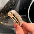 Fermaglio dorato per coda di cavallo con quattro file di strass, lunghezza 4,8cm - Lunghezza circa 4.8cm / Oro