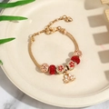 Golden DIY snake chain charm bracelet featuring red crystal beads and lotus pendant - Lotus Gold Theme (Style 2) / 18cm