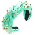 Detail view of mint green knotted headband with white pearls and crystal flower accents - Mint Green