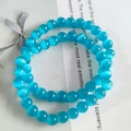 Blue 8mm cat eye stone beaded bracelet with glossy finish wrapped in two loops - Lake Blue Cat Eye