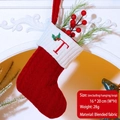 Red knit Christmas stocking with white plush cuff and embroidered letter T design - Letter T / Red