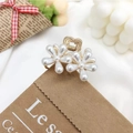 Golden daisy flower hair claw clip with white pearls for elegant half-up hairstyles - Double Flower Claw Clip