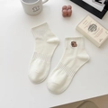 Beige mid-calf cotton socks with embroidered animal detail and ribbed cuffs in minimalist style - Capybara - Lying Down / 1 Pair