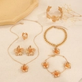 Golden floral textured jewelry set featuring necklace bracelet earrings and ring on tray - Gold 6-Piece Set: Earrings + Necklace + Bracelet + Bangle + Ring + Anklet