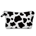 Detail of multi-functional cow print pouch featuring a sturdy zipper and side carry handle - Cow Print