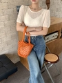 Detail of orange handwoven bucket bag featuring a white drawstring inner lining - Orange (with inner bag)