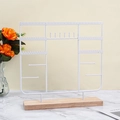 White metal jewelry stand with wooden base for necklaces and bracelets storage - White