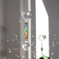 Silver heart crystal suncatcher creating vibrant rainbow light spots in the sun - Multi-layered Heart