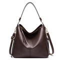 Detail of dark brown hobo bag with pebble leather texture and gold-tone hardware - Coffee