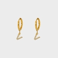 Close-up of gold-plated hoop earrings featuring a V-shaped pendant with pavé zircon stones - Letter V
