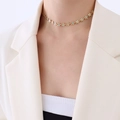 18k gold flower necklace with light blue enamel petals worn on a model's neck - Double-sided Enamel Necklace 35+5cm