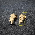 Macro shot of gold leaf stud earrings measuring 13mm by 6mm on a black texture - 028 Leaf / Gold