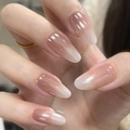Close-up of pink and white gradient almond press-on nails with a glossy jelly finish - Glue Type / Milky Pink Gradient Style (BY1353)