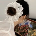 Elegant oversized double-layer white lace scrunchie shown on a woman's high bun - Q449-1 White Double Layer Lace