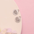 Close-up of silver heart-shaped pendants with sparkling crystals on a white plate - 5# Silver Full Rhinestone Heart